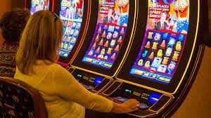 Filipino player using the 66win App on a smartphone to access casino games